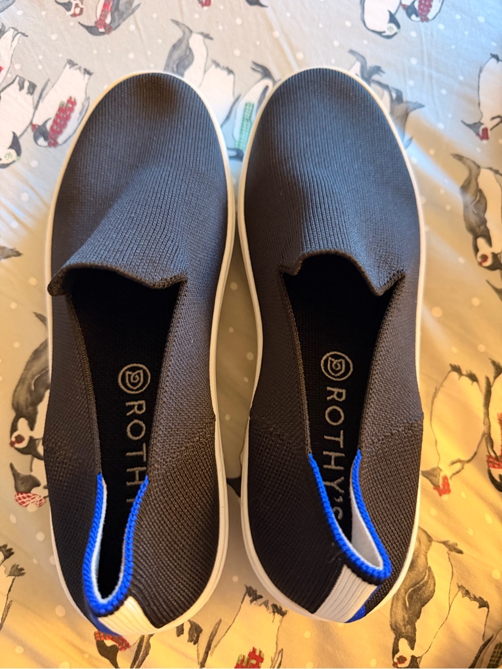 NWOT  Sz 9 Rothy's Slip-On Knit Sneakers in Black with Blue Trim
